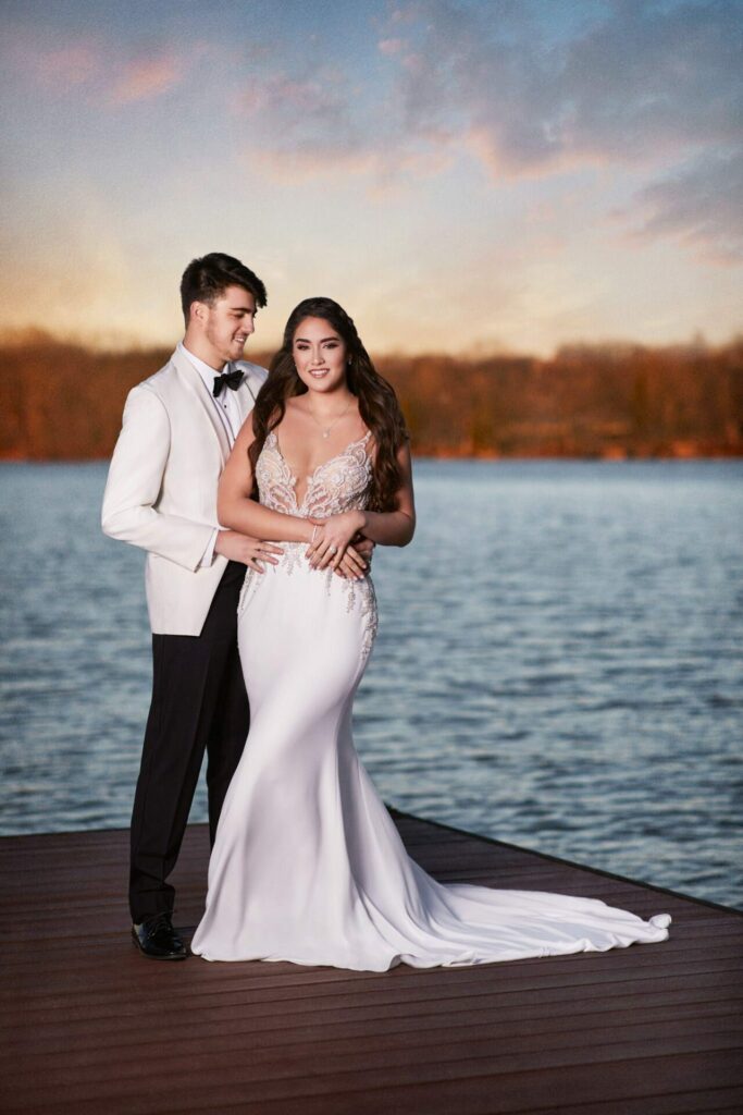 Portrait of a couple standing by the lake